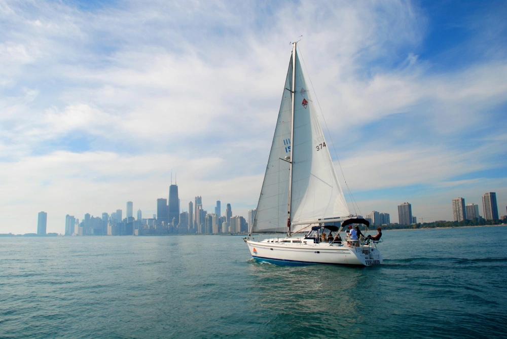 Private luxury sailboat sailing on Lake Michigan with the Chicago skyline in the background