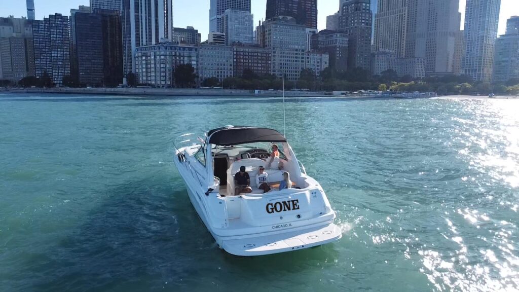 Luxury yacht cruising on Lake Michigan with the Chicago skyline in the background