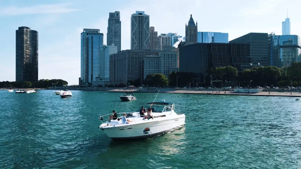 Premium yacht cruising on Lake Michigan with the Chicago skyline in the background