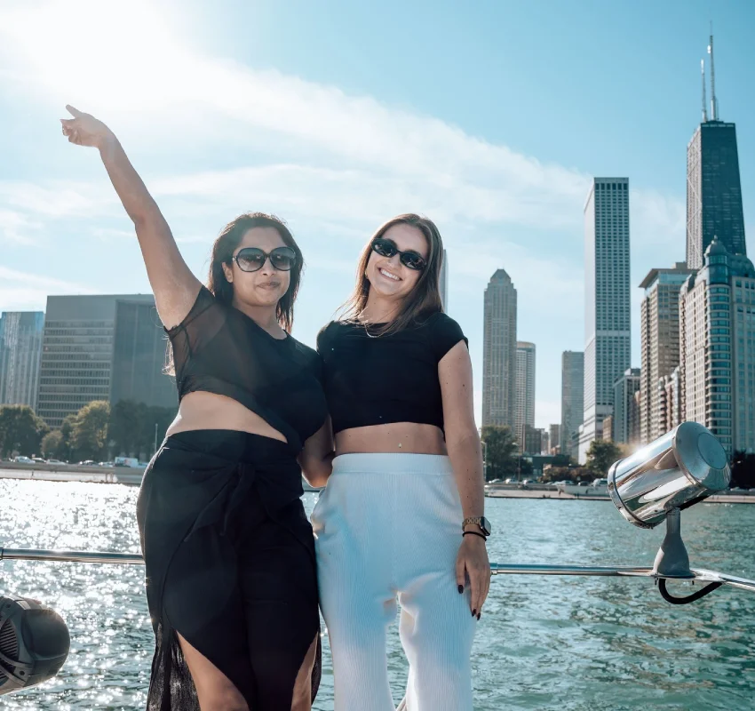 Friends enjoying a private boat rental with captain Chicago with the skyline behind them