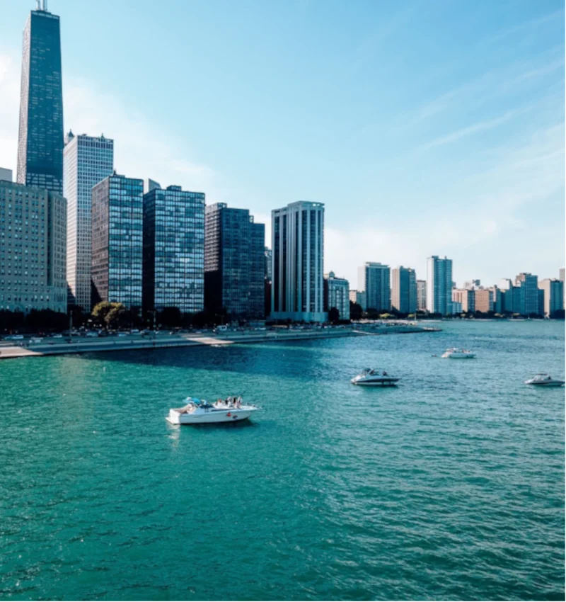 Charter boat rental in Chicago cruising on Lake Michigan with the Chicago skyline view.