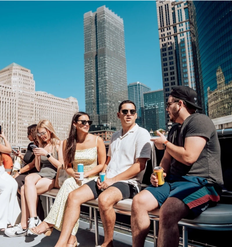 Group enjoying a private boat tour in Chicago with downtown skyline views.