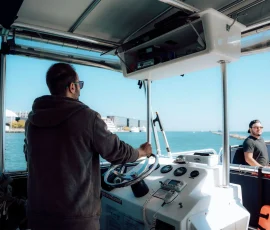 Captain operating a big boat charter on Lake Michigan in Chicago