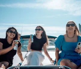 Friends enjoying a private sailboat charter on Lake Michigan in Chicago