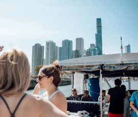 Group of friends posing on a sailboat charter in Chicago