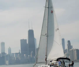 Luxury sailboat cruising on Lake Michigan with the Chicago skyline