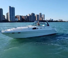 Luxury yacht cruising on Lake Michigan with the Chicago skyline
