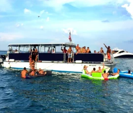 Party boat rental in Chicago with guests swimming in Lake Michigan