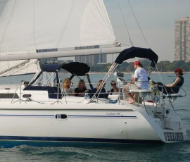 Guests enjoying a private sailboat rental on Lake Michigan